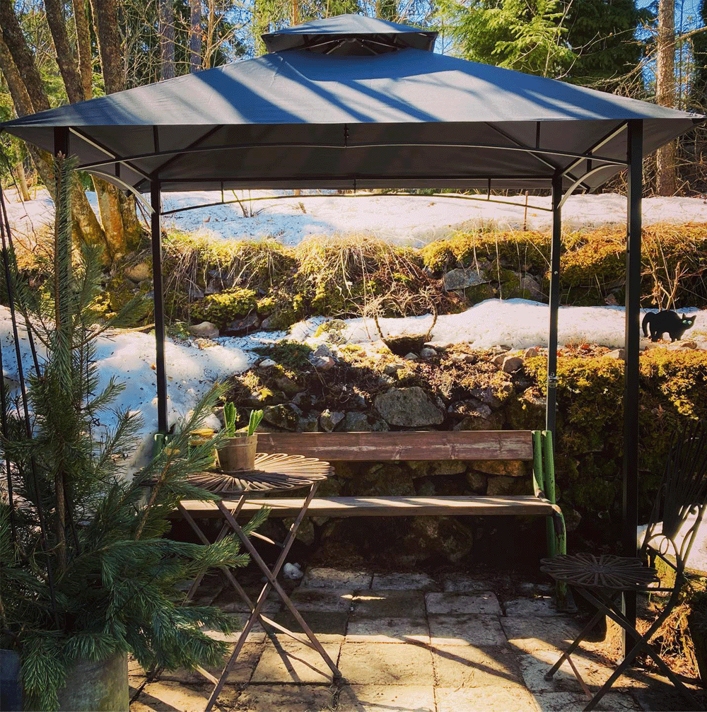 Outdoor swing bench with a snowy background